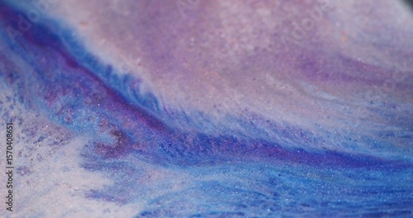 Fototapeta Paint spill. Water mix. Defocused blue purple white color sparkling marble glitter liquid floating on abstract acrylic background.