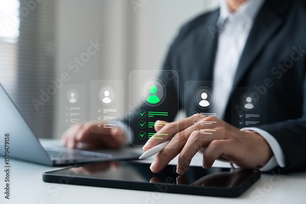 Fototapeta Digital recruitment and human resource HR technology transformation, showing a businessman using AI-powered tools to evaluate candidate profiles on a smart device.