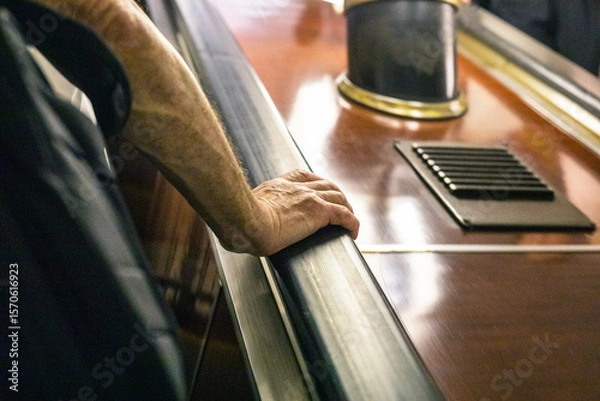 Obraz elderly man's hand holding the railing on the escalator