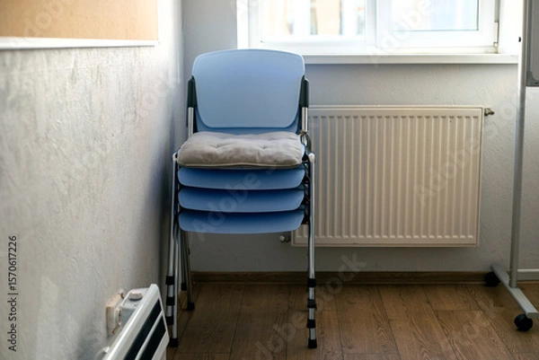 Obraz chairs stacked in a classroom. Back to school
