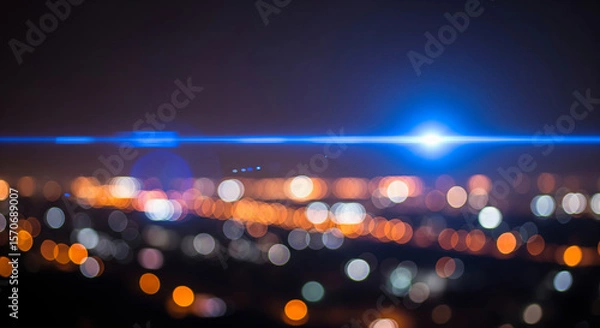 Fototapeta Abstract blue anamorphic lens flare overlaying blurry city night background, beautiful cinematic light effect with amazing colorful festive bokeh