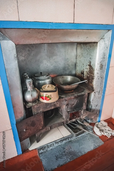 Fototapeta Cooking food on a traditional stove in the house of the Pamir population of the Pamirs in the village of Karakul