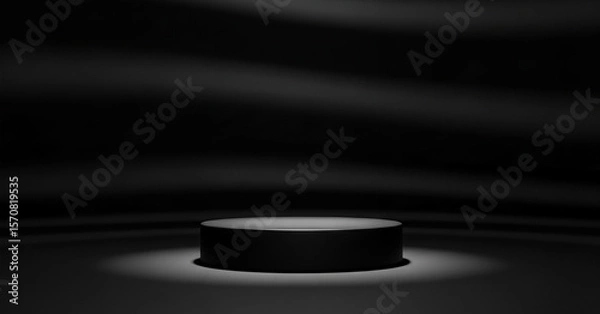 Fototapeta Black cylindrical podium illuminated by spotlight against dark draped background featured in a minimal branding concept for design-focused products