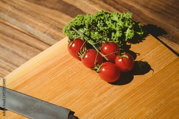 Obraz Tomatoes and parsley on chopping board
