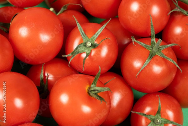 Fototapeta Close-up of a group of fresh whole cocktail tomatoes.