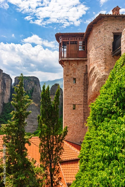 Fototapeta Historic monastery tower with wooden balcony overlooking cliffs in Meteora Greece