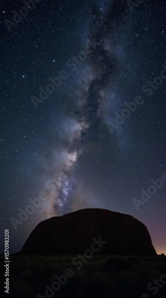 Fototapeta Uluru Ayers Rock in Australia Beneath a Star-Filled Night Sky with the Milky Way