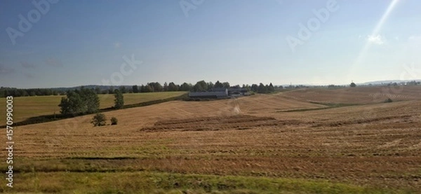 Fototapeta Norway Klofta Serene Countryside Landscape with Rolling Green Fields Beneath Clear Skies