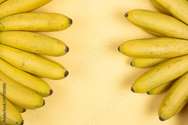 Fototapeta Bunch of mini baby bananas, copy space for text