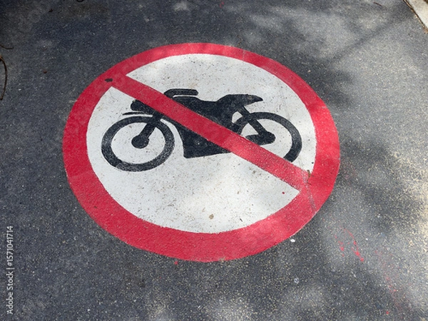 Fototapeta On the road there is a sign "No motorcycles allowed". A zone where parking is prohibited.