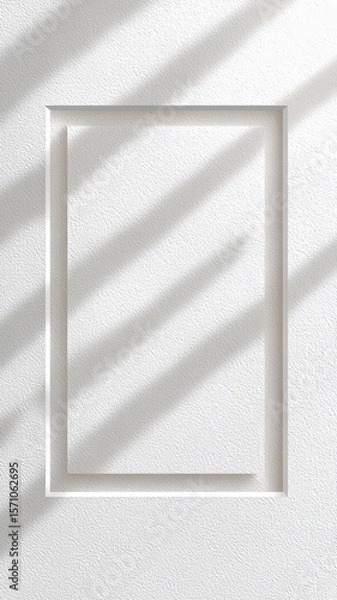 Fototapeta Minimal White Frame Casting Soft Shadows Against a Textured Surface in Contemporary Setting