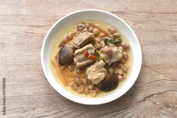 Obraz boiled chop pork bone with peanut and black mushroom soup on plate