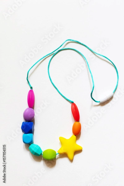 Obraz Colorful silicone teether necklace in the form of a rodent on a white background