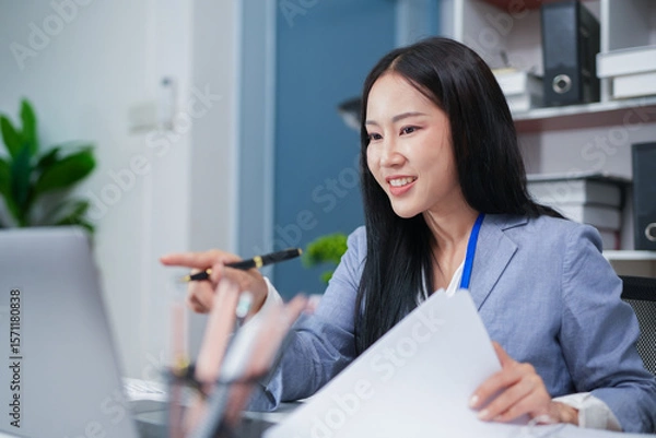 Fototapeta Accountant woman working on financial investment on calculator, calculation, business growth analysis and marketing on graph at office.
