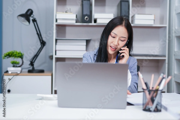 Fototapeta Accountant woman working on financial investment on calculator, calculation, business growth analysis and marketing on graph at office.