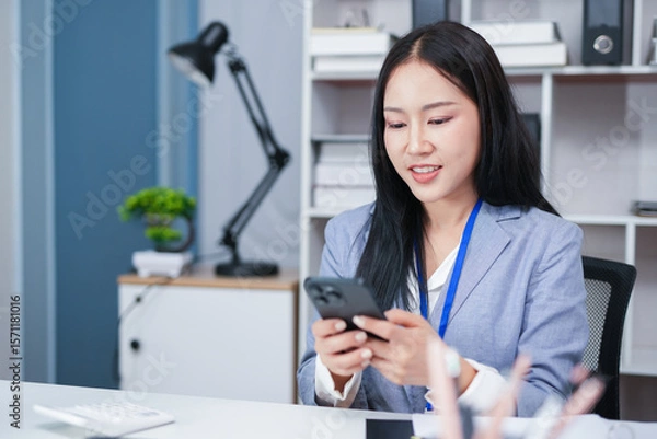 Fototapeta Accountant woman working on financial investment on calculator, calculation, business growth analysis and marketing on graph at office.