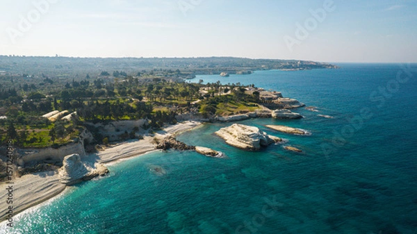 Fototapeta Aerial view of white rocky coastline in Syria. Rocks on coast beautiful sea bay at Latakia beach. Natural landscapes by the sea.