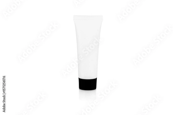 Fototapeta A blank white cosmetic cream tube with a black cap for a product mockup. A container for lotion, gel, or beauty products, isolated on white background with clipping path.