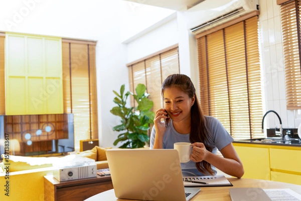Fototapeta Woman enjoys book and music in modern abode.