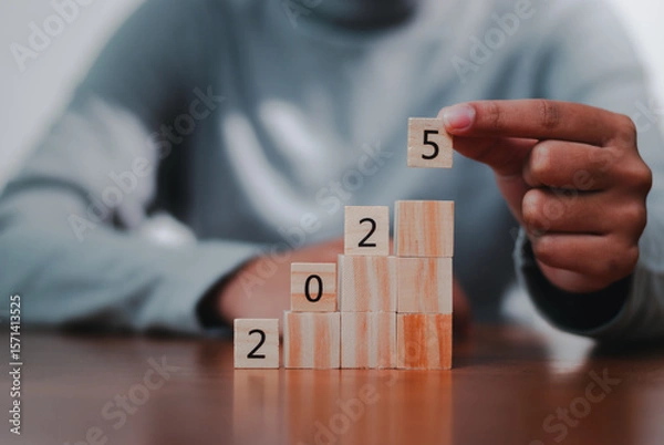 Fototapeta Business growth strategy tracking progress with blocks office environment motivational concept
