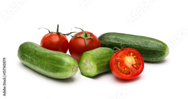 Fototapeta Fresh vegetables on a white background, cucumbers and tomatoes