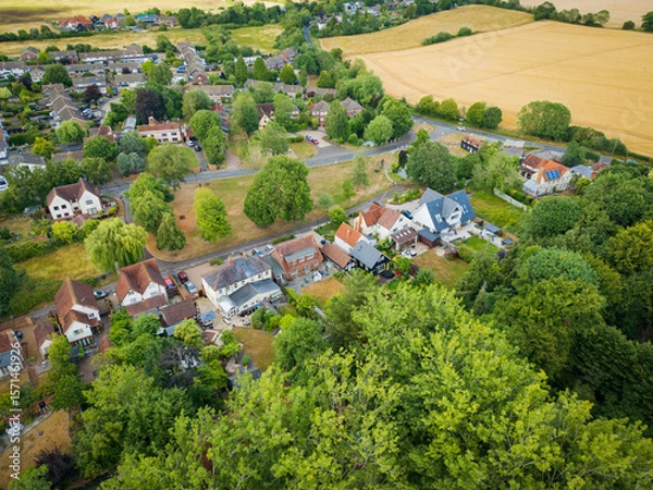 Fototapeta Aerial view of fine, detached and large private houses located within a rural community in England. Seen adjacent to the village green.