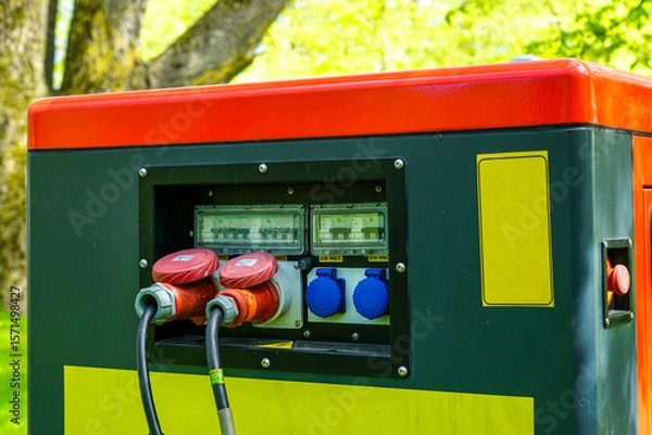 Fototapeta Close-Up of Power Generator Panel with 230V Sockets and Cables in Outdoor Energy Setup