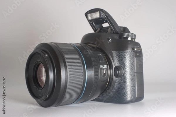 Fototapeta High quality DSLR camera on a light background showing detailed features and modern design