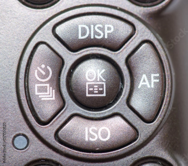 Fototapeta Camera control button layout featuring key functions like display, autofocus, and ISO settings for photography enthusiasts