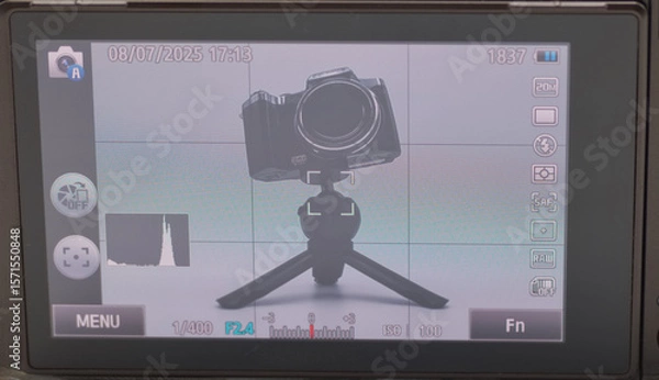 Fototapeta Camera setup on a tripod with display settings visible for perfect shot composition in a controlled environment