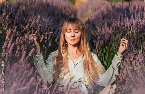 Obraz Woman Practicing Meditation and Breathing Exercises in Lavender