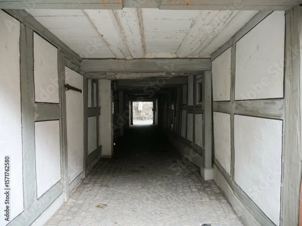 Obraz Long hallway with white walls and wooden beams