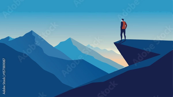 Obraz Lone Hiker on Mountain Ridge – A hiker standing alone on a narrow ridge and looking at the vastness.