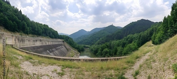 Fototapeta Clean Energy Technology Depicted in a Panoramic Photograph of a Hydel Power Facility Generating Renewable Power from Flowing River Water