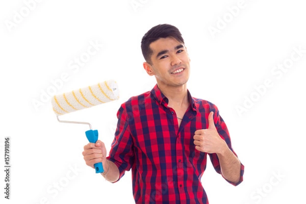 Obraz Young man holding a roll