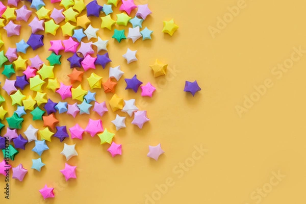 Fototapeta Colored stars. Yellow background.