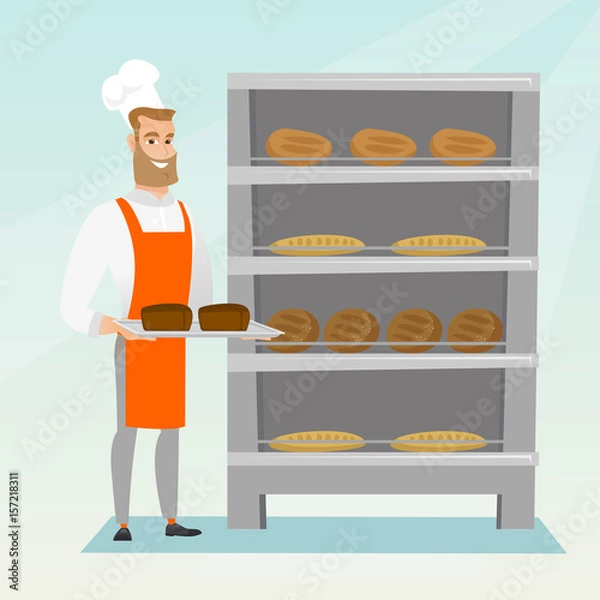 Fototapeta Happy young baker holding a tray with bread.