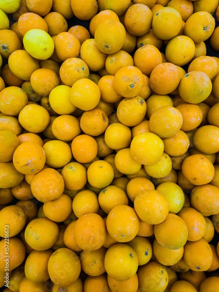 Fototapeta Fresh ripe oranges as background, top view.