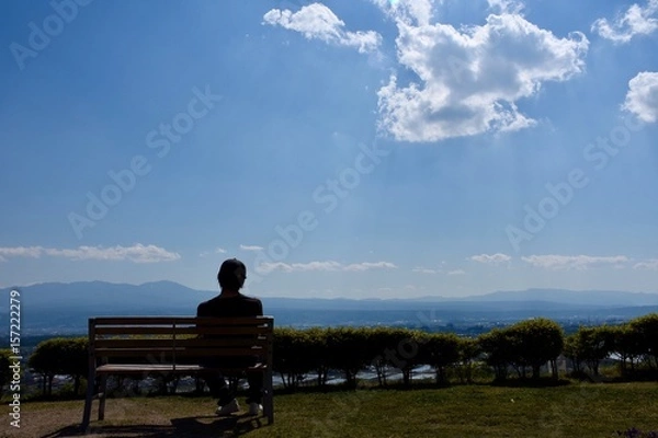 Fototapeta ベンチに座る人