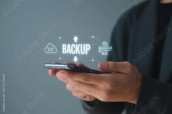 Obraz Person holding smartphone with cloud backup data transfer technology icons mobile phone
