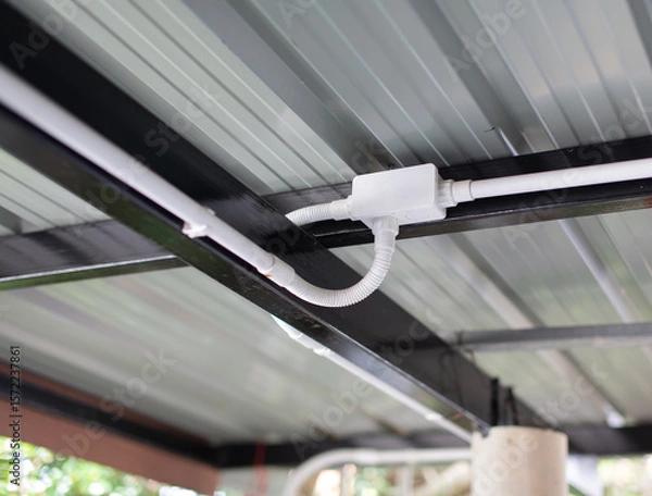 Fototapeta Electrical conduit connection points installed on metal roof sheets