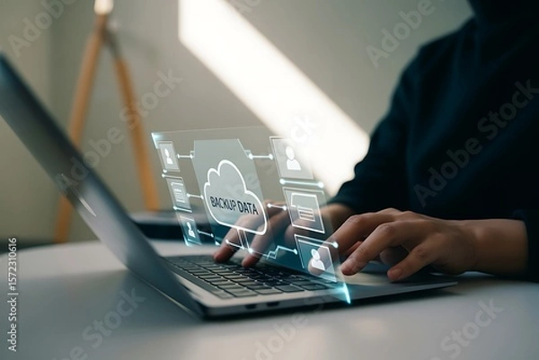 Obraz Person using laptop with holographic cloud data backup interface hands typing