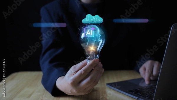 Fototapeta businesswoman’s hand holding a glowing light bulb, symbolizing artificial intelligence, creative innovation, and future-thinking in business and technology.