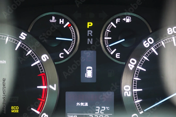 Fototapeta Speed gauge with engine light.