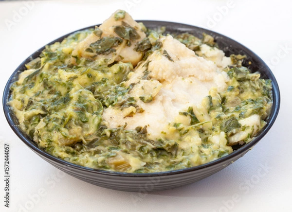 Obraz Traditional South African side dish of spinach and pap or maize meal