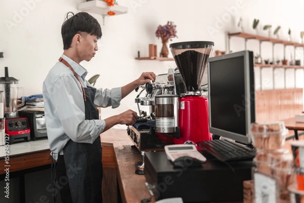 Obraz Barista brewing coffee in urban , action shot showcasing craftsmanship, side view focus