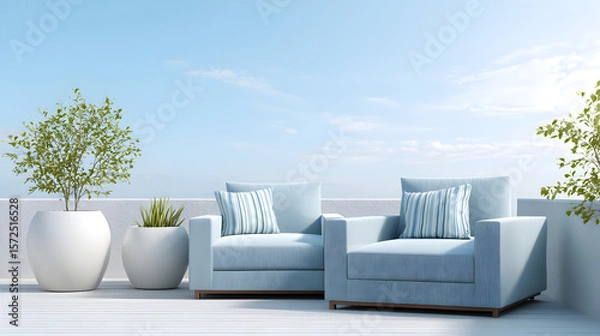 Obraz Modern outdoor seating area featuring two light blue armchairs with striped cushions, surrounded by decorative planters and a clear blue sky, creating a serene relaxation space