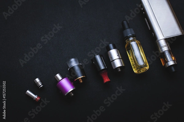 Obraz Popular vaping device mod.Upgrade parts for modern vaporizer e-cig device,spare parts.New device model,micro coil clearomizer.Quit smoking nicotine cigarette,start vaping safe ecig vape