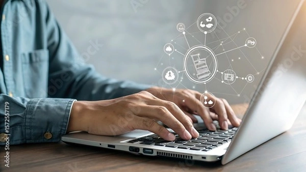 Obraz Person working on a laptop with online connected icons illustrating digital workflow and communication.