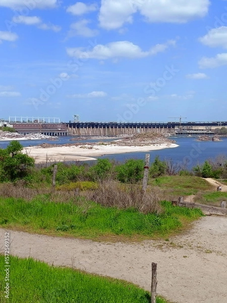 Fototapeta View from the sandy path at the foot of the Zaporizhian Sich on the large rapids near the Dnieper Dam on a summer sunny day.